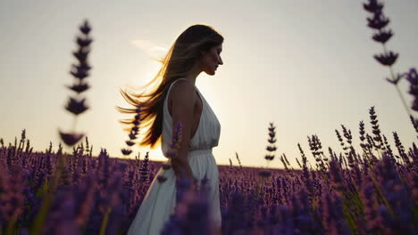 woman in a lavender field at sunset