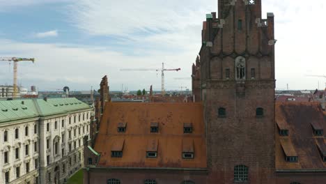 Aerial-Pedestal-Down-Reveals-Old-Building-in-Europe-on-Summer-Day