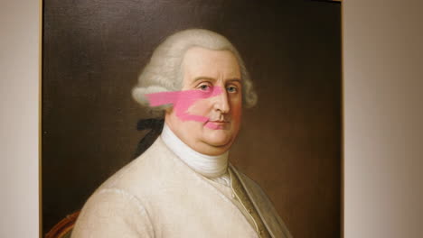 18th century portrait painting defaced with pink paint