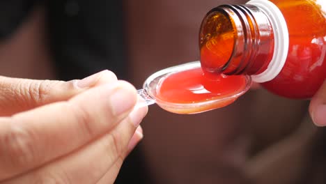 child's medicine being measured out