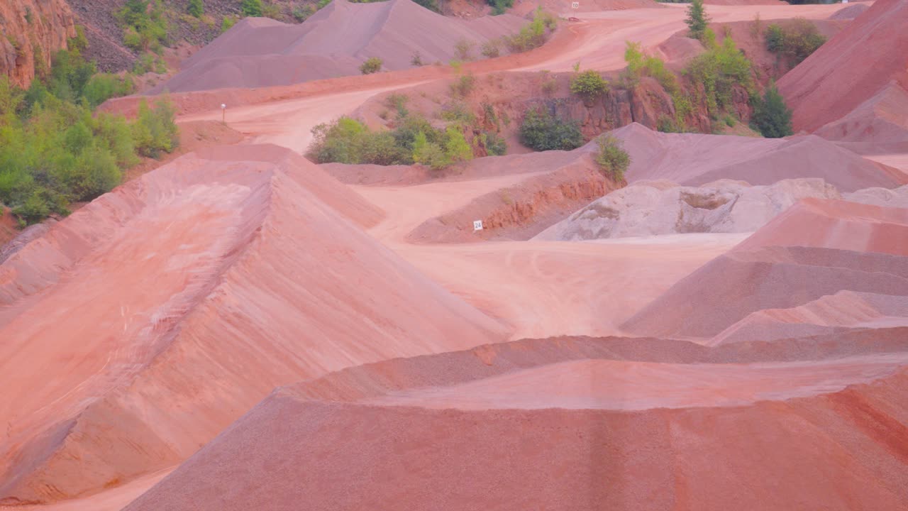 Slow Rising Pan of Empty Quarry with Dirt Truck Road to Removing Materials Such as Sand Stone Gravel to Use for Buildings and Roads