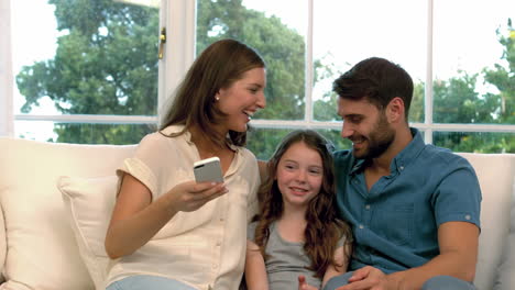 family taking selfie together