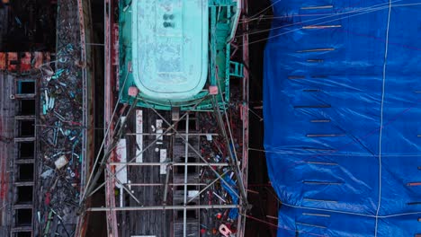 abandoned fishing boats in a dockyard