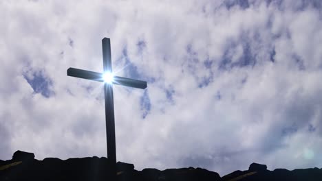 sculptures of crosses on the rocks with a timelapse background of clouds in the sky