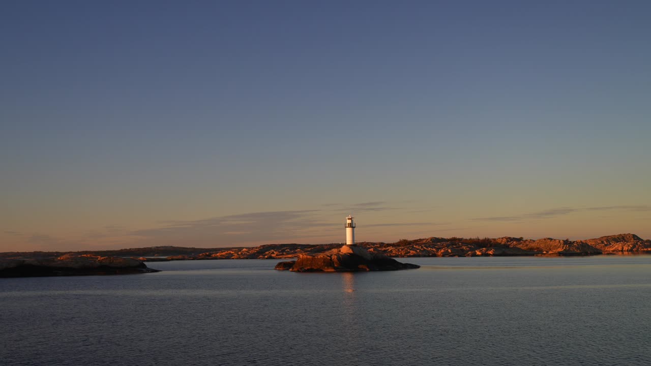 Ferry Boat ride Lighthouse Stromstad Fjord Ursholmen Sweden land of the Svea Sverige calm sea ocean water late arctic afternoon sunset Strömstad Nordkoster enchanting coastal beauty circle motion