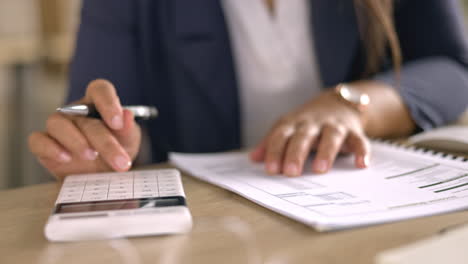 taxes, paperwork and calculator with woman hands