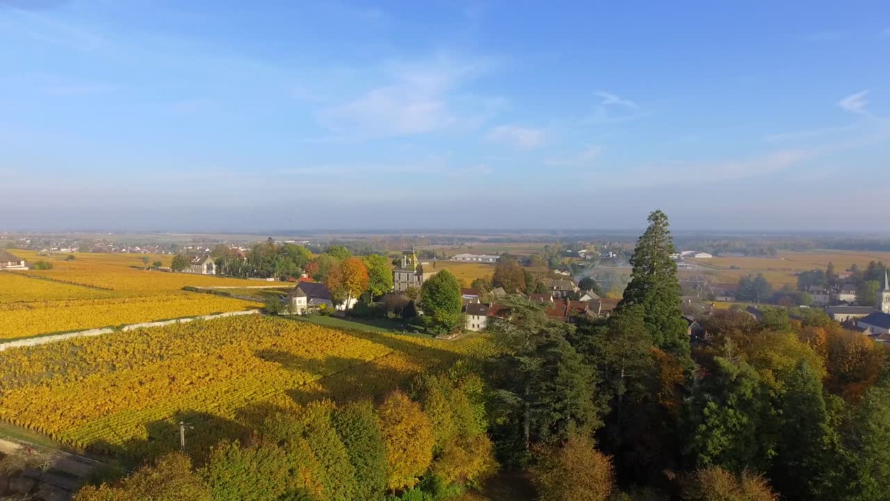 4K aerial rise on a french village in fall - Burgundy