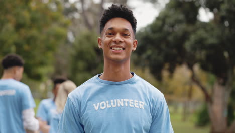 smiling volunteer man in a blue shirt