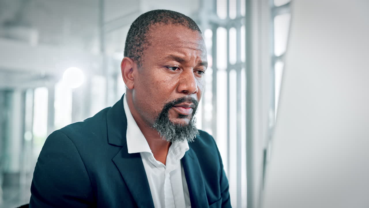 Focused African American Businessman Working on Computer in Office