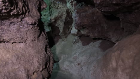 a dark and rocky cave passage