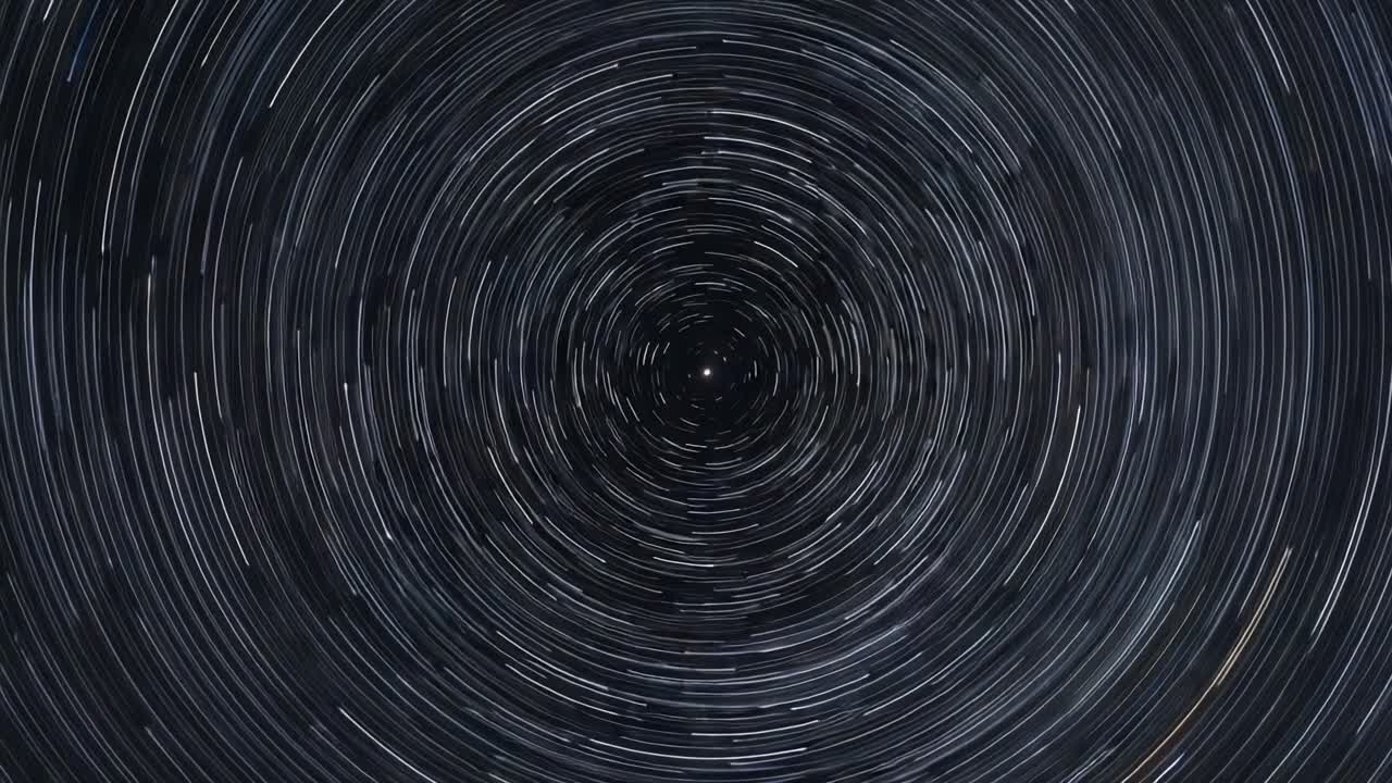 Dynamic Star Trails Create a Mesmerizing Circular Motion Above, Capturing the Essence of Celestial Movement and the Vastness of the Night Sky