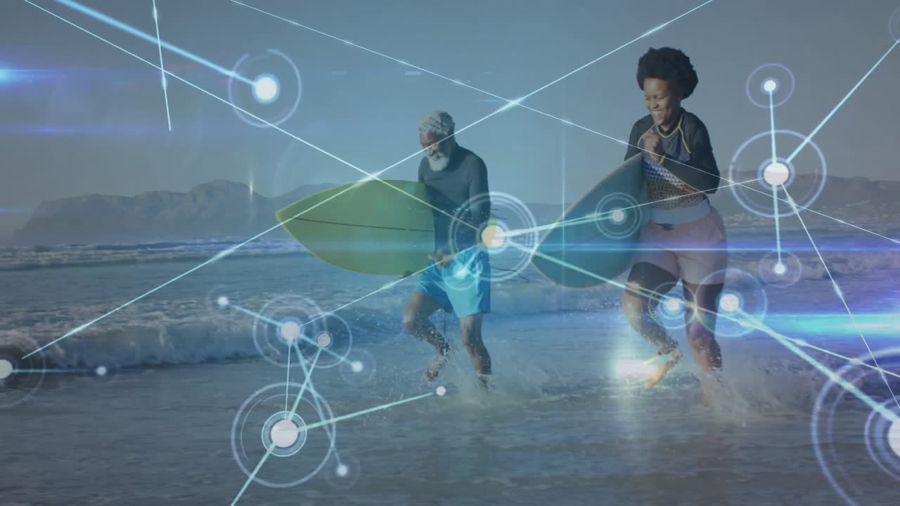 man surfer and woman surfer splashing with surfboards showing node overlay for tech marketing