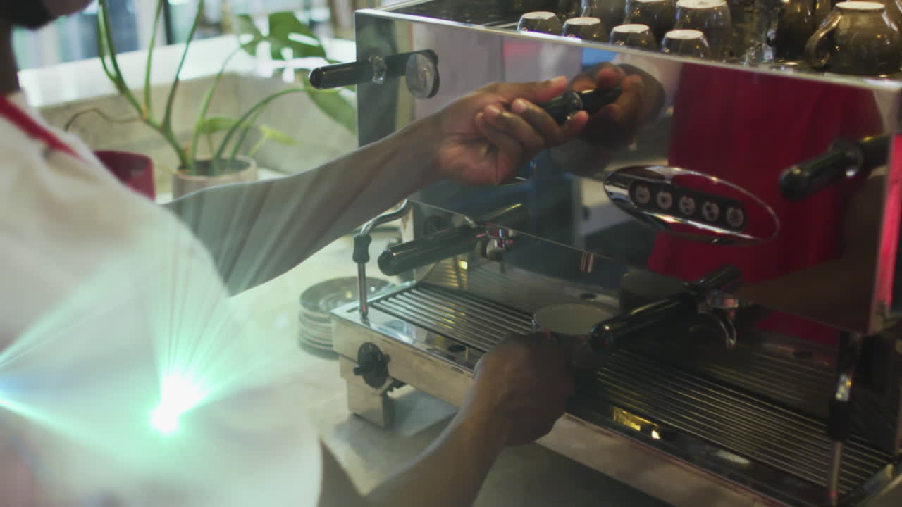 Animation of light spots over biracial man preparing coffee in cafe