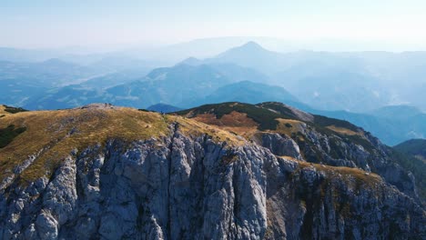 stunning 4k drone footage of saddle bellow kordezeva glava - peca mountain in karavanke mountain range