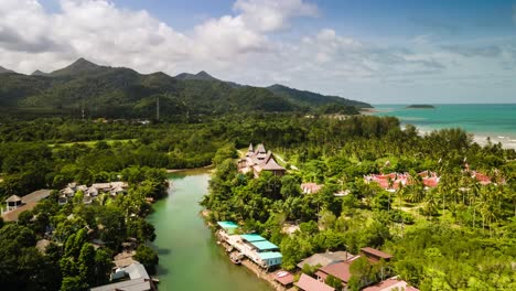 time lapse of cumulus clouds forming over mountainous with river and ocean on the island of koh chang