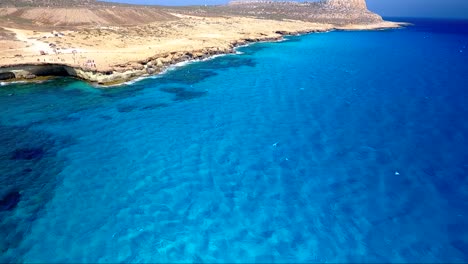 crystal clear turquoise blue water at sea caves ayia napa cyprus view