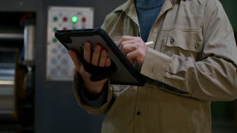 factory worker using tablet