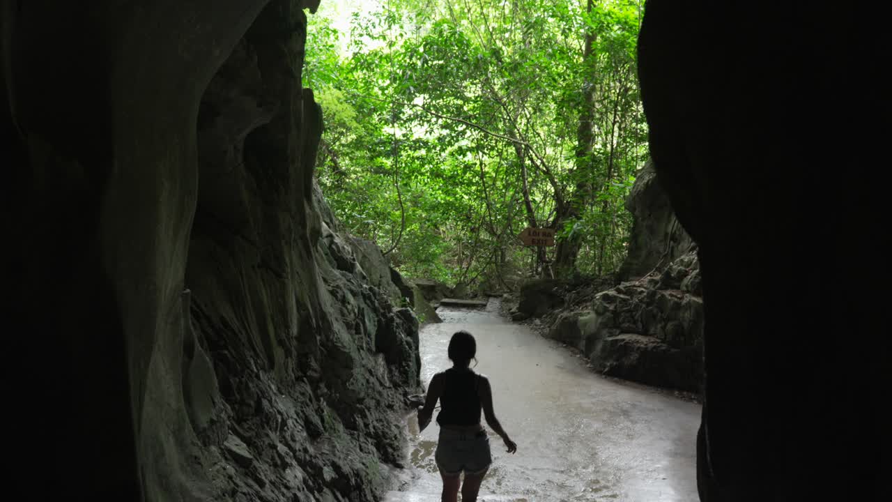 Tourist visiting Trung Trang Cave cave interior outdoor jungle nature Vietnam Cat Ba island