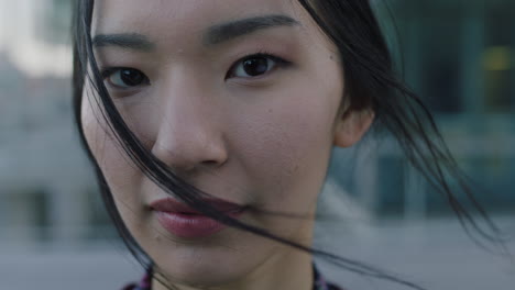 portrait-of-young-asian-business-student-woman-in-windy-city