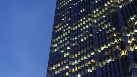 panning across toronto's financial district in the evening, with brightly lit skyscrapers