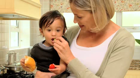 Mother-giving-food-to-her-son