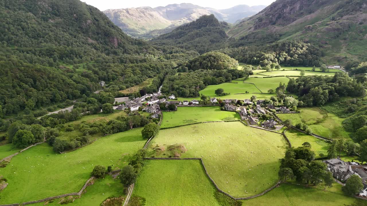 Flyover drone shot of Borrowdale vally. A scenic English village near Derwent Water surrounded by stunning fells