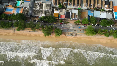 Cinematic-aerial-view-of-Ao-Nang-public-beach-coastline-with-the-view-of-main-street,-Krabi,-Thailand