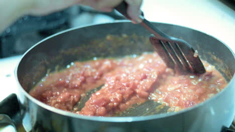 chili being prepared in the kitchen. stirred slowly and on low heat for great taste