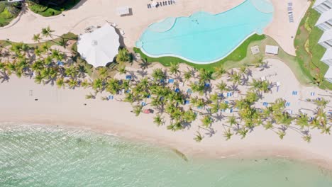 aerial view of swimming pool at marbella hotel by white sand beach at juan dolio, dominican republic