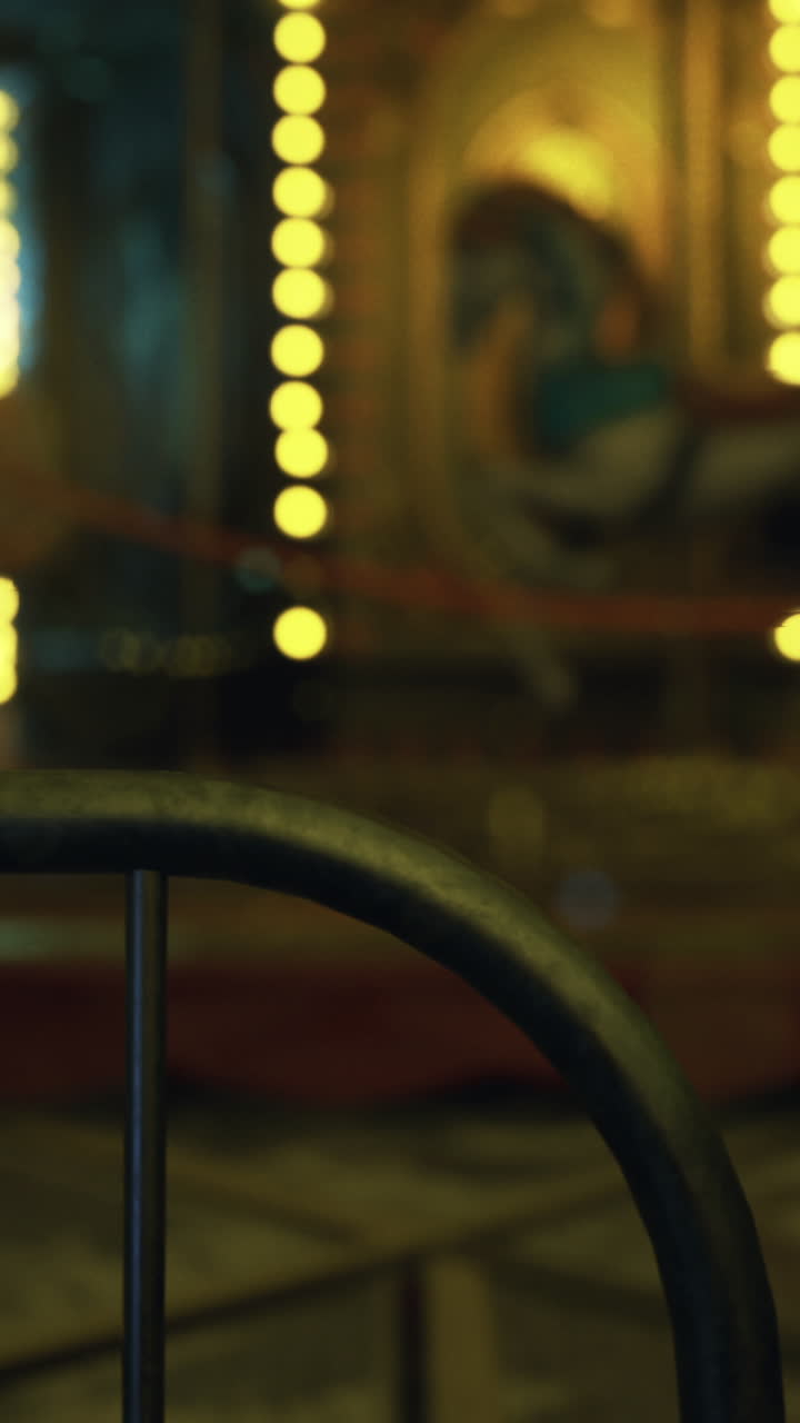 Abandoned carousel at night with warm lights and festive atmosphere