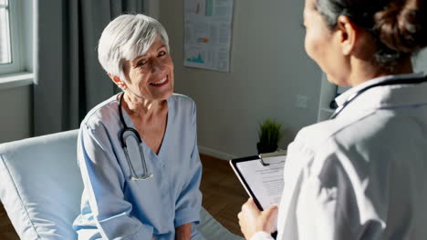 elderly patient consults with a doctor in a medical setting