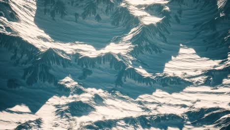 aerial view of the alps mountains in snow