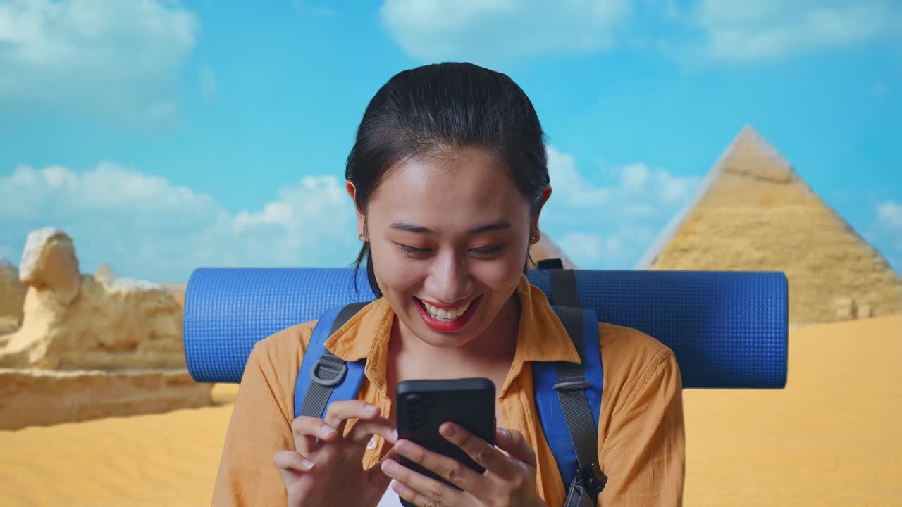 Excited Woman Looking at Phone in Egypt