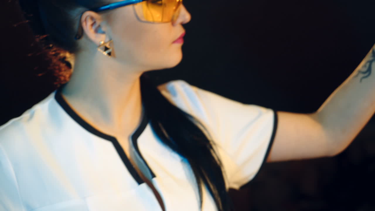 Woman scientist mixing together two liquid substances. Laboratory examination.