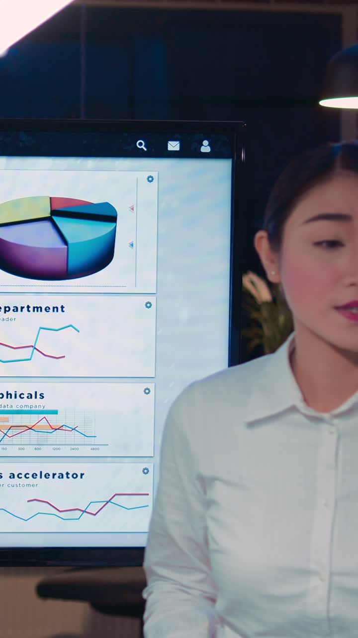 Vertical video: Business analytics team meeting, woman showing corporate presentation
