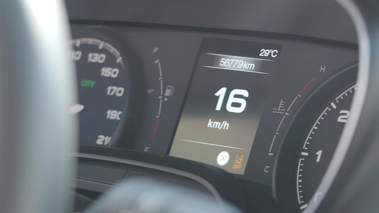Car Dashboard Display Showing Speed and Vehicle Information