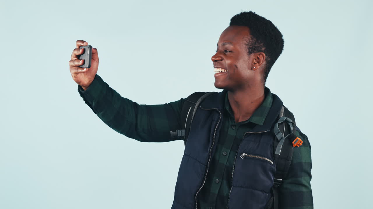 Selfie, thumbs up and black man in studio
