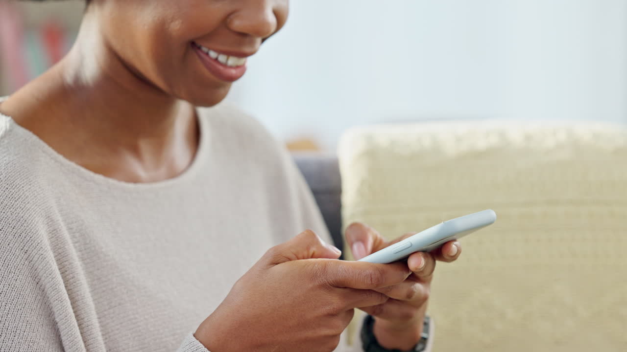 Smiling woman texting on phone