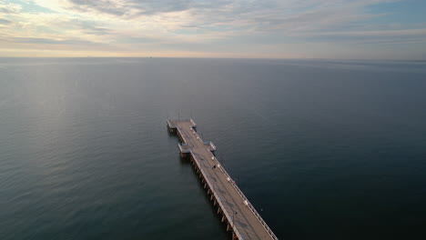 Aerial-View-of-Gdynia-Orłowo-Pier-And-Endless-Baltic-Sea-at-Vivid-Stunning-Sunrise