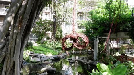 serene pond with floating wreath, changing subtly