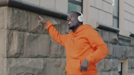 happy man dancing in the city