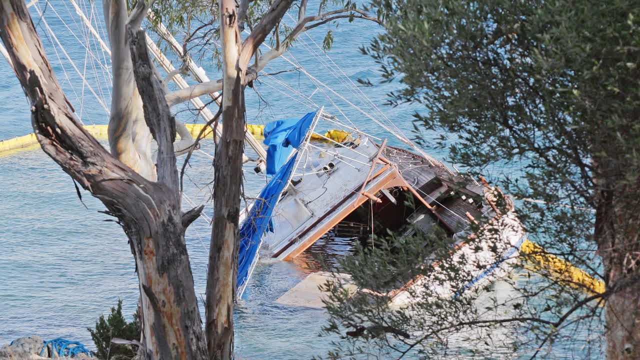 sunken yacht on the rocky coast in ithaca, greece