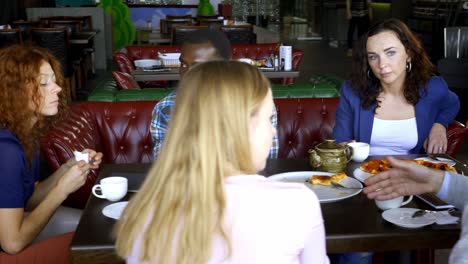 diverse happy friends eating italian pizza together.