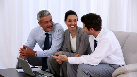 Business-man-and-woman-sitting-on-couch