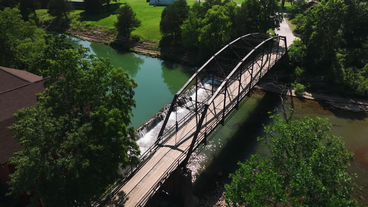 Bird's eye aerial view of historical bridge of war eagle in Benton country