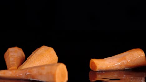 a fall of fresh carrot in the water splash.
