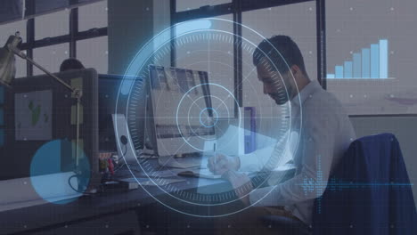 business professional working at desk with digital data overlay animation