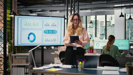 vertical video chief executive officer evaluating productivity reports in company space