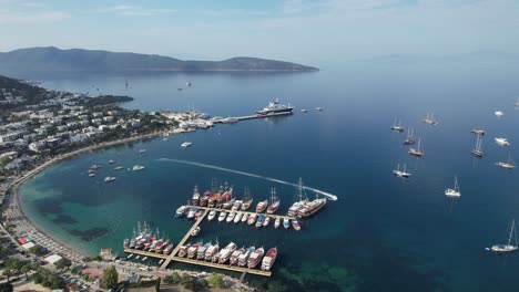 Drone-shot-of-Bodrum-marina-with-boats-parked,-Turkish-Riviera