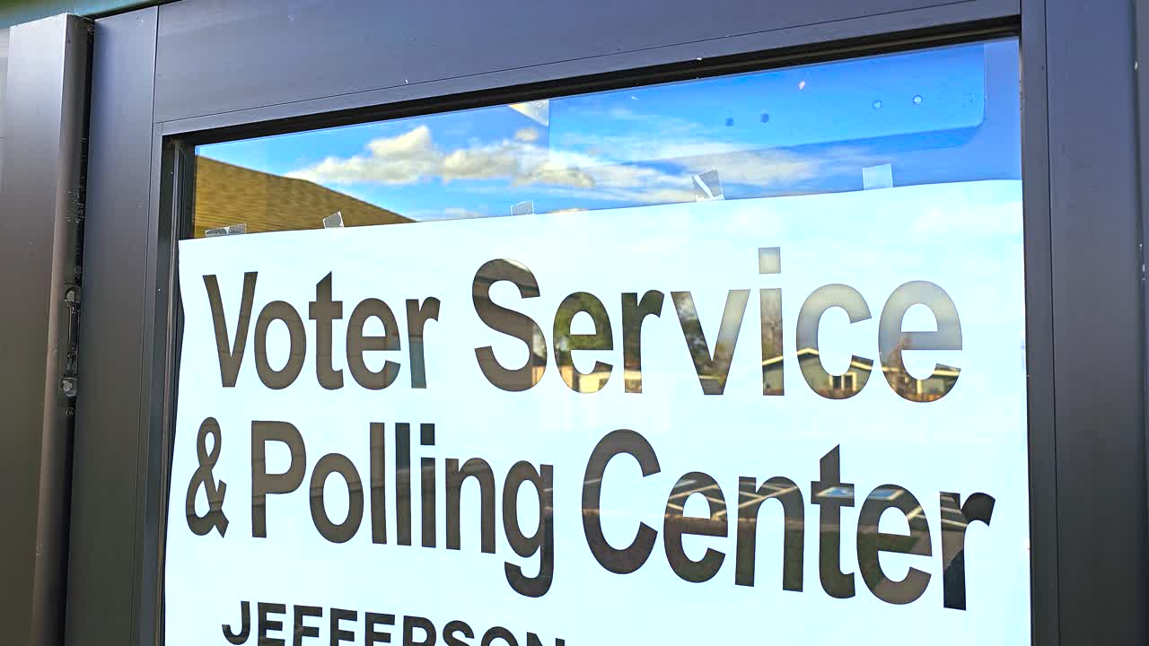 Stock footage of a simple “Voting Service Polling Center” sign, emphasizing civic engagement, voter registration, and accessibility to official in-person election services in the community
